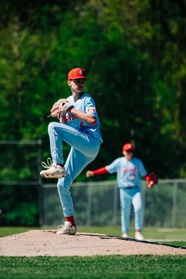 A Cardinals pitcher delivers during a home game.